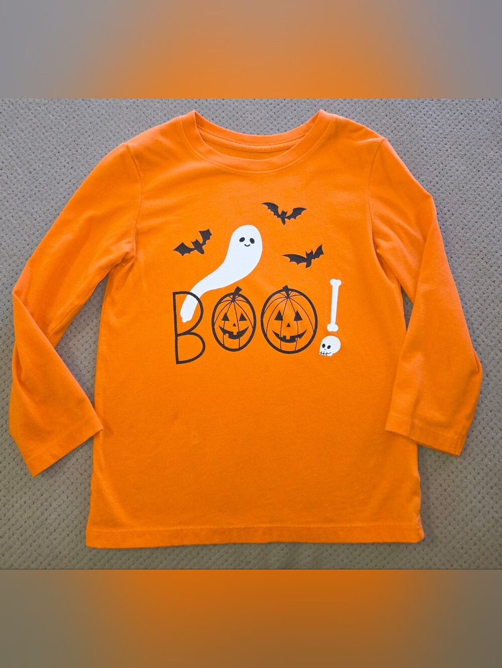 orange long-sleeve shirt appears to be from the Cat & Jack Halloween 4t
